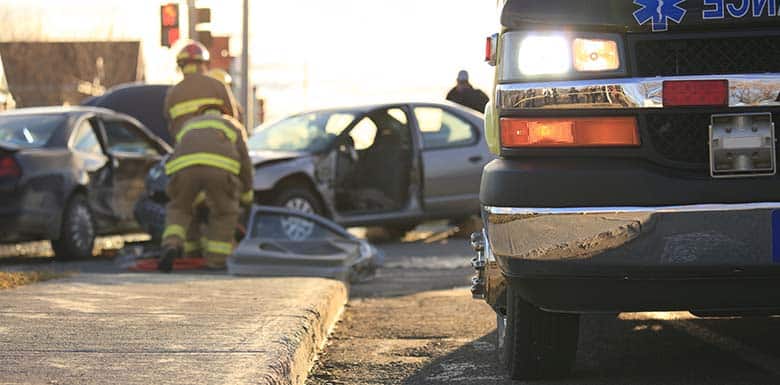 Ambulance next to car wreck scene