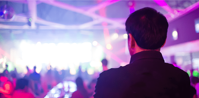 Police officer watching a crowd at a concert